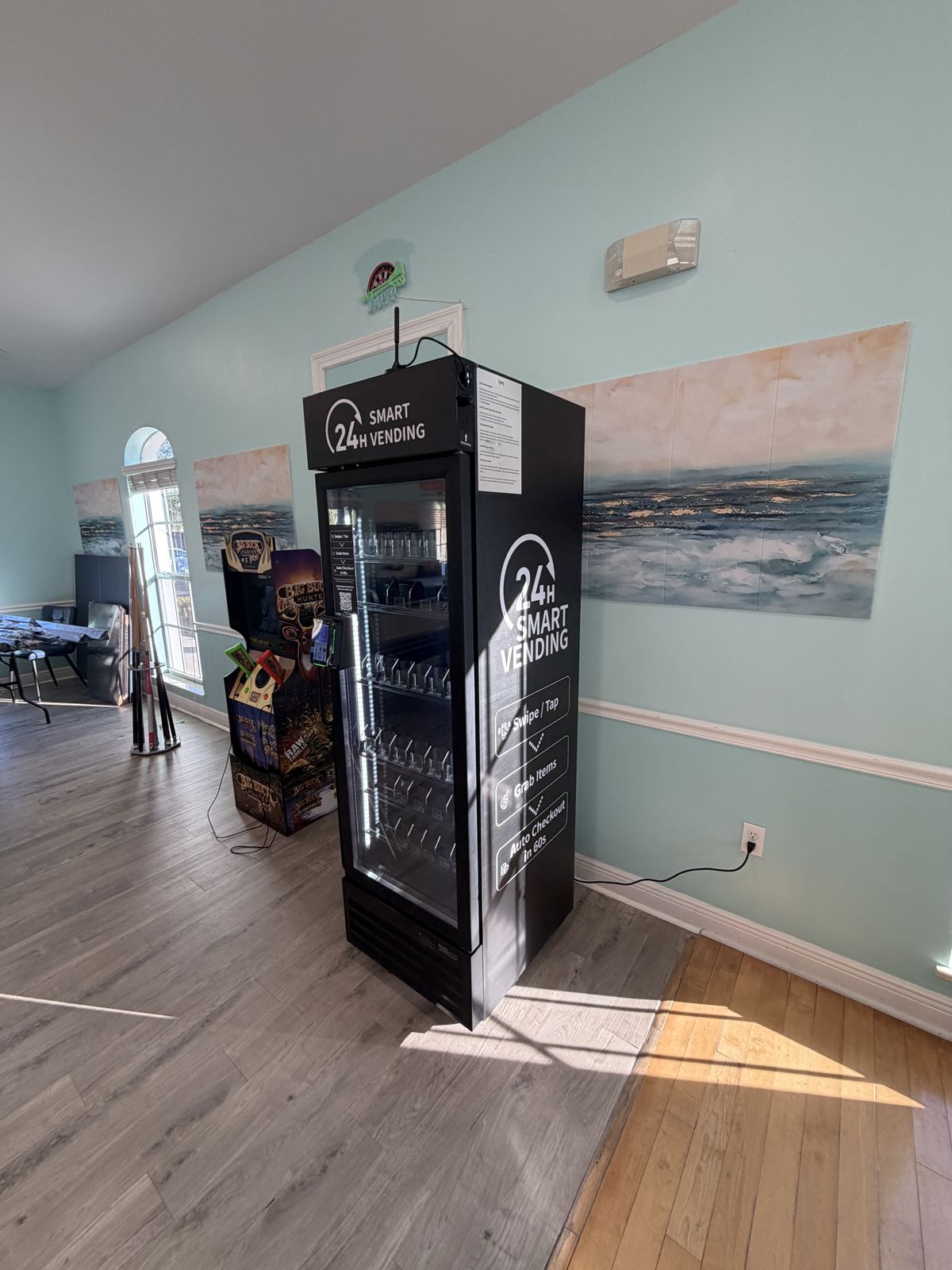 Mini Smart Mart smart fridge installed against the wall of the Neapolitan Cove RV Park clubhouse.